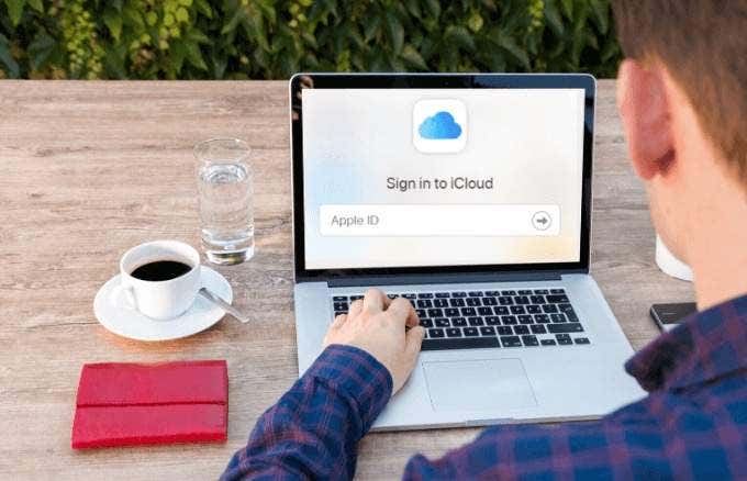 Someone signing into iCloud on a laptop